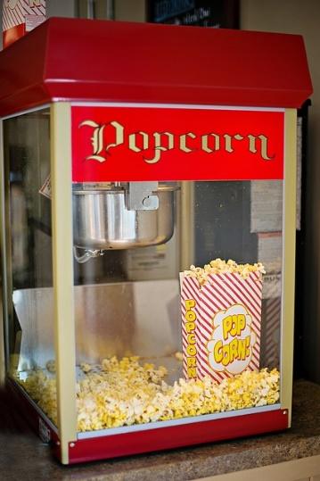 A red vending machine with popcorn Description automatically generated with medium confidence