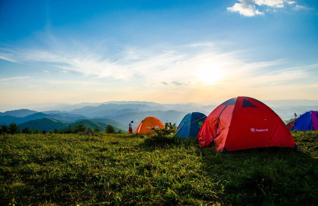 Photo by Xue Guangjian: https://www.pexels.com/photo/photo-of-pitched-dome-tents-overlooking-mountain-ranges-1687845/
