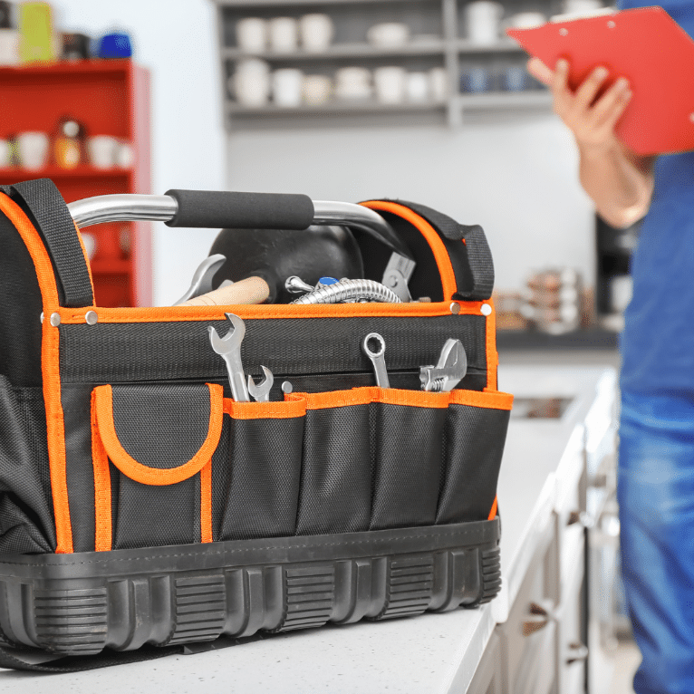 A tool bag with tools in it

Description automatically generated